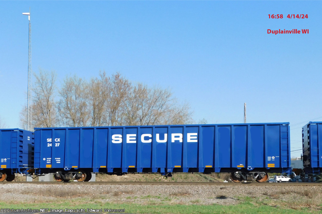 17 new GE lease gondolas roll north on CN - wonder what SECURE is